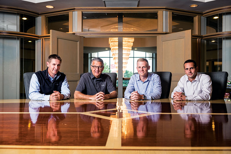 Troy Gunden, Ed Herr, Jim E. Herr and Jeremiah Thomas sitting at a conference table