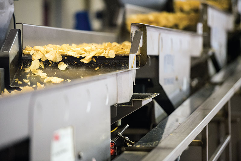 Herr's Potato Chips on A Conveyor Belt in The Herr's Snack Factory