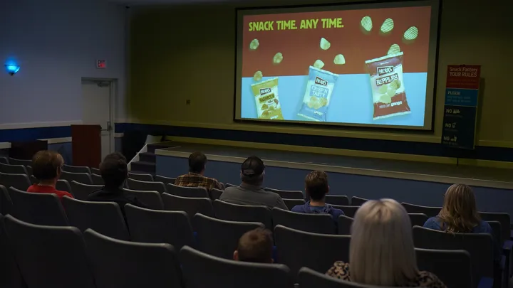 People watching a show in Chippy's Theater